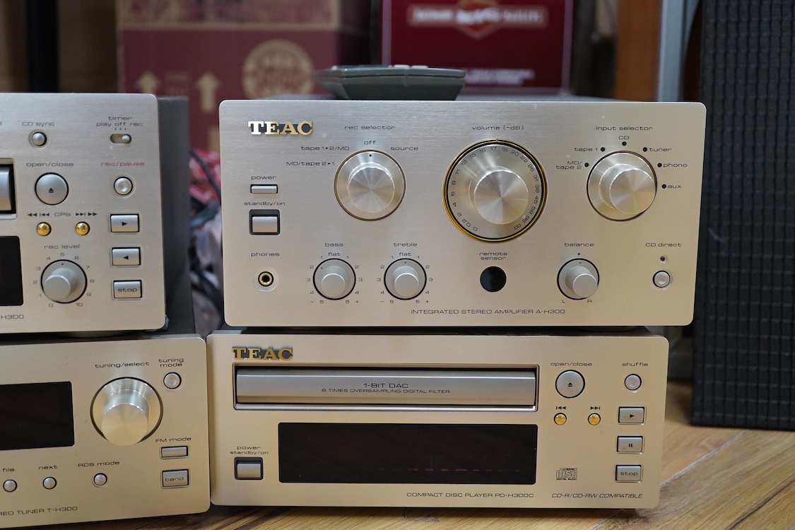 A TEAC four part Hi-Fi system with Celestrion F30 floor standing speakers, comprising a PD-H300C CD Player, a T-H300 AM/FM Tuner, an A-H300 integrated stereo amplifier, and a R-H300 stereo cassette deck, plus a remote co